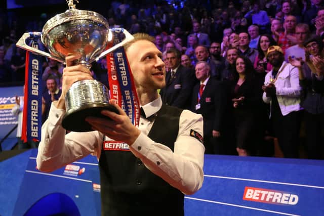 Judd Trump celebrates with the trophy after winning the 2019 Betfred World Championship at The Crucible, Sheffield (Picture: PA)