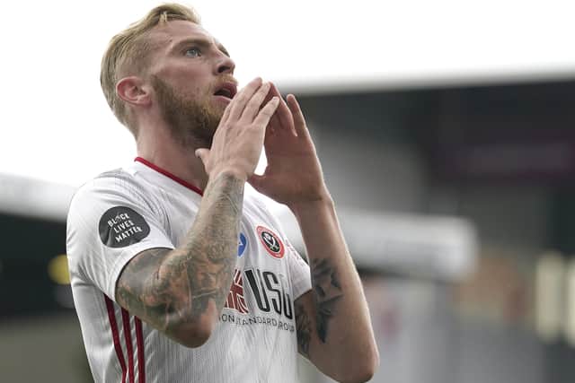 Blades' Oli McBurnie reacts after missing a chance (Picture: Andrew Yates/Sportimage)