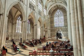 Worshippers socially distance during the first public Holy Communion to be held at York Minster since the easing of coronavirus lockdown restrictions.