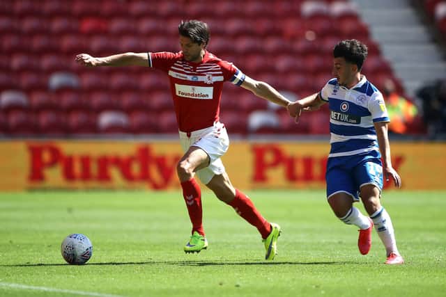 Middlesbrough's George Friend (left) and Queens Park Rangers' Ilias Chair battle for the ball during the Sky Bet Championship match at the Riverside Stadium, Middlesbrough. PA Photo. Picture date: Sunday July 5, 2020. See PA story SOCCER Middlesbrough. Photo credit should read: Tim Goode/PA Wire. RESTRICTIONS: EDITORIAL USE ONLY No use with unauthorised audio, video, data, fixture lists, club/league logos or "live" services. Online in-match use limited to 120 images, no video emulation. No use in betting, games or single club/league/player publications.