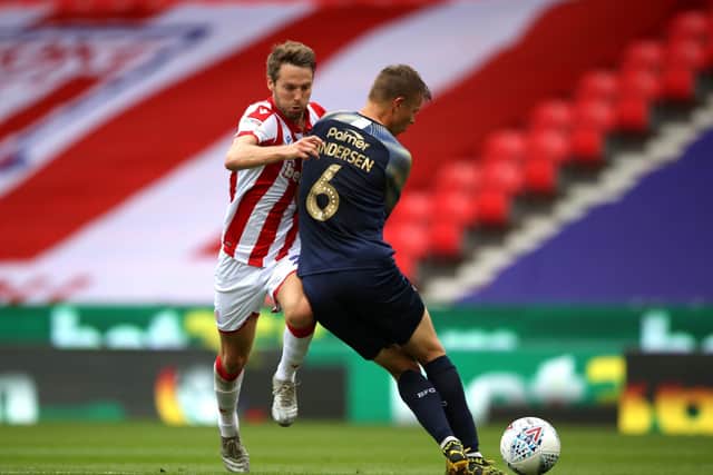 Stoke City's Nick Powell (left) and Barnsley's Mads Andersen battle for the ball.