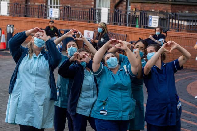 NHS staff during a Clap for Carers celebration. Photo: James Hardisty.