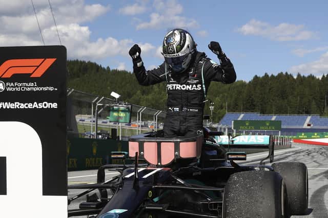 Race winner Mercedes driver Valtteri Bottas of Finland celebrates after winning the Austrian Formula One Grand Prix at the Red Bull Ring racetrack in Spielberg, Austria, Sunday, July 5, 2020. (Mark Thompson/Pool via AP)