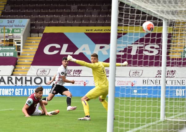 Sheffield United's John Egan scores at Burnley. Pictures: PA.