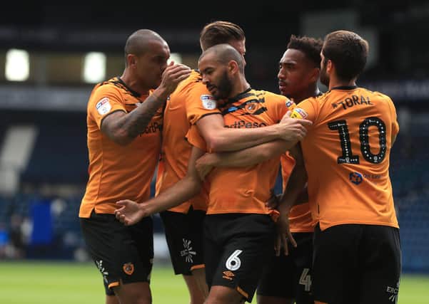 Hull City's Kevin Stewart (centre) celebrates scoring his side's first goal of the game with team-mates during the Sky Bet Championship match at The Hawthorns, West Bromwich. PA Photo.