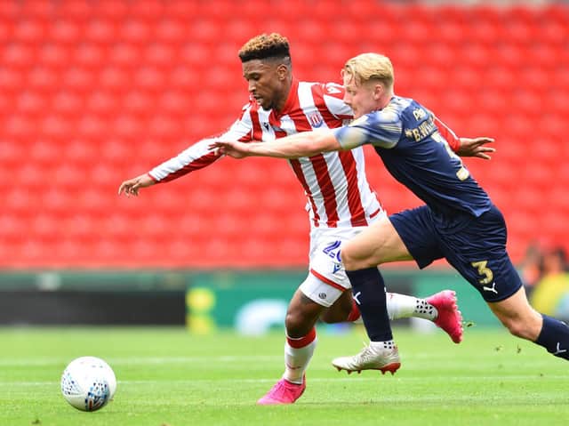 Impressive Stoke City forward Tyrese Campbell tussles with Barnsley full-back Ben Williams. PICTURE: NATHAN STIRK/GETTY IMAGES.