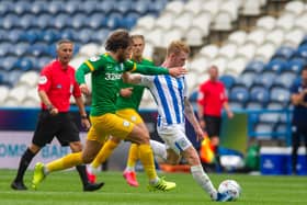 LINING IT UP: Lewis O'Brien has an effort at goal for Huddersfield Town. Picture: Tony Johnson.