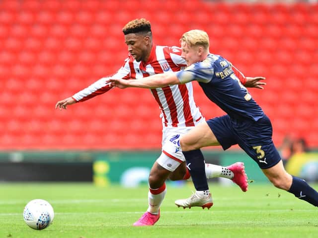 BATTLING:  Tyrese Campbell of Stoke City and Ben Williams of Barnsley compete for the ball. Picture: Nathan Stirk/Getty Images.