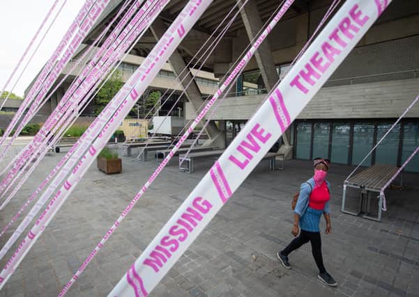 The National Theatre in London is wrapped in tape to illustrate the difficulties facing the cultural sector during the Covid-19 lockdown.