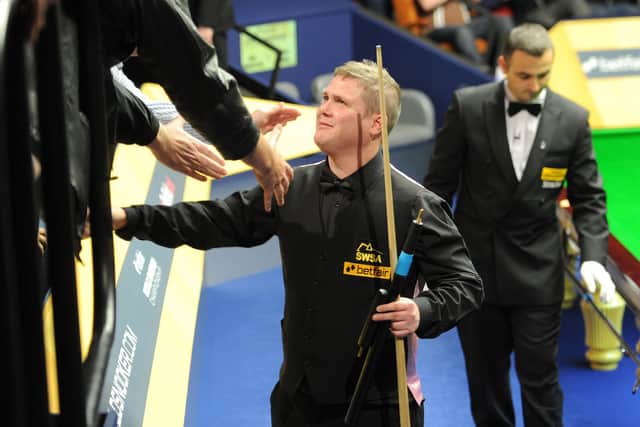 Robert Milkins celebrates with fans after defeating Neil Robertson during the Betfair World Championships at the Crucible (Picture: Martin Rickett/PA Wire)