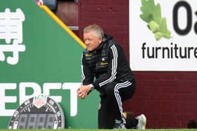 Sheffield United manager Chris Wilder takes a knee in support of the Black Lives Matter movement during the Premier League match at Turf Moor at the weekend Picture: Peter Powell/NMC Pool/PA