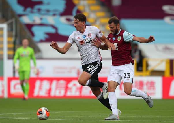 IN THE THICK OF IT: Sheffield United's Sander Berge battles with Burnley's Erik Pieters at Turf Moor. Picture: Simon Bellis/Sportimage