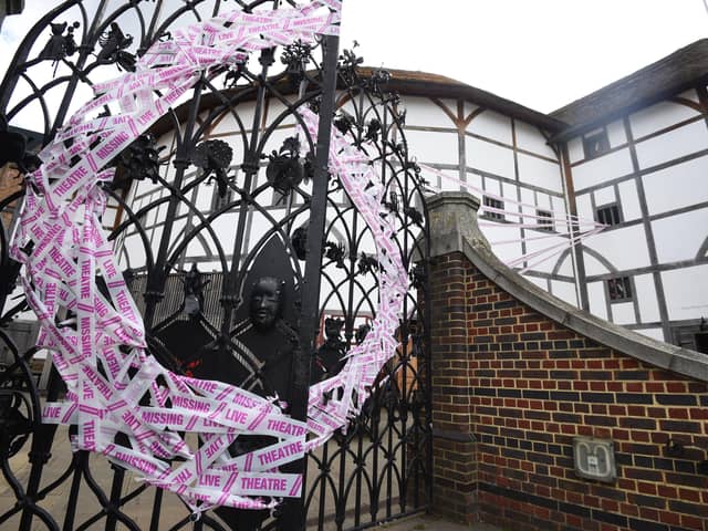 Tape covers the gates at Shakespeare's Globe theatre as a part of the Scene Change initiative, as the lifting of further lockdown restrictions in England comes into effect.