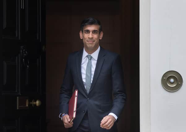 Chanclelor Rishi Sunak leaves 11 Downing Street to deliver his economic update and £30bn stimulus.