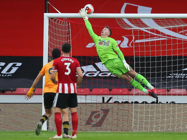 A free-kick from Wolves midfielder Ruben Neves flies past Sheffield United keeper Dean Henderson and clips the bar in the 32nd minute. PHOTO: SPORTIMAGE.