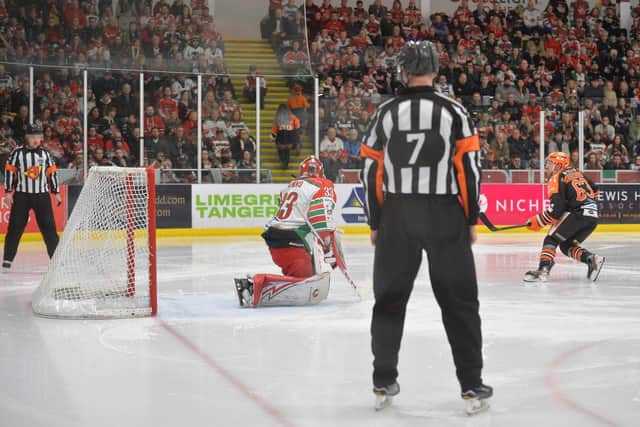 Brendan Connolly, right, slots home a penalty shot past Ben Bowns during Sheffield Steelers' Challenge Cup Final win over Cardiff Devils in March. Picture courtesy of EIHL.