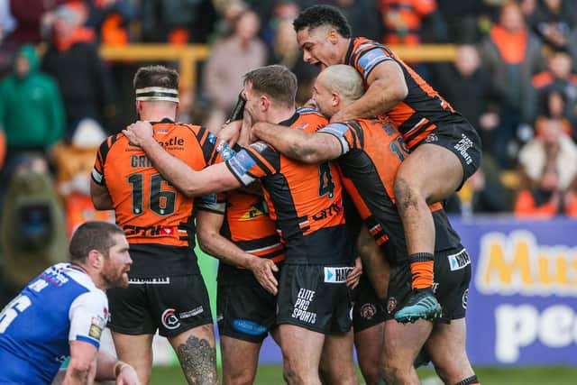 STRONG FINISH: Castleford Tigers celebrate victory over St Helens in their final game before the shutdown. Picture: Alex Whitehead/SWpix.com.