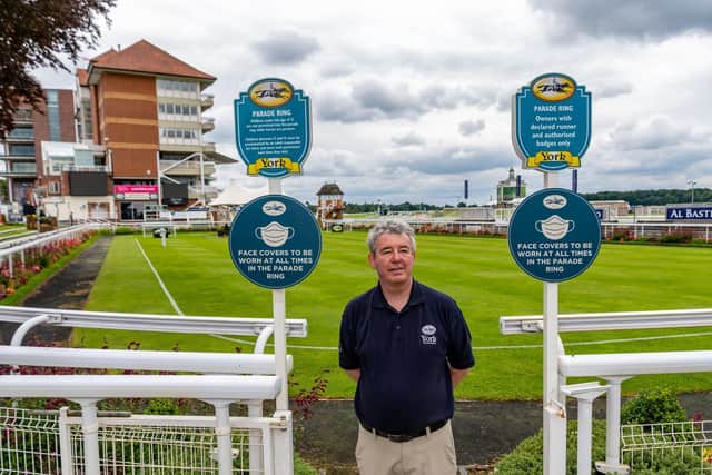 James Brennan, Head of Marketing and Sponsorship for York Racecourse, ensures all the necessary signage is in place for the meeting. Picture James Hardisty