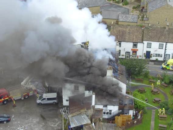 A drone image shows the fire at its height