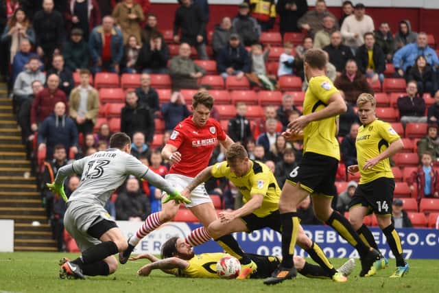 SAFETY NET: Cauley Woodrow was part of the Burton Albion side that clinched Championship safety at Oakwell back in April 2017.