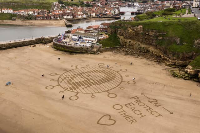 Sand Art in Whitby taken by drone by Sand in Your Eye
.