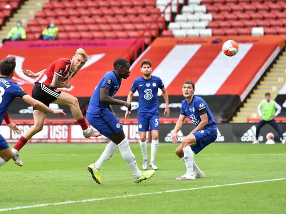 Oli McBurnie heads in Sheffield United's second. Picture: Peter Powell/NMC Pool/PA Wire.