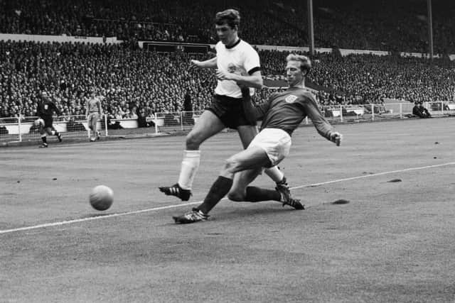 Jack Charlton tackles Wolfgang Weber for the ball during the 1966 World Cup final at Wembley Stadium, London, 30th July 1966. Picture: Central Press/Hulton Archive/Getty Images)