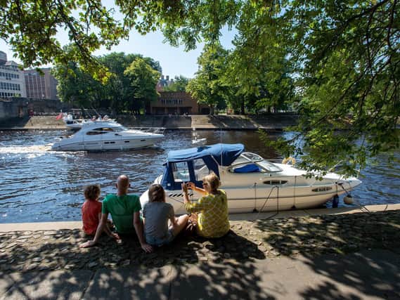 A family sit in the shade by the River Ouse in York last year Picture: Bruce Rollinson
