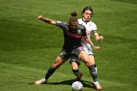SWANSEA, WALES - JULY 12: Kalvin Phillips of Leeds United is tackled by Conor Gallagher of Swansea City during the Sky Bet Championship match between Swansea City and Leeds United at the Liberty Stadium on July 12, 2020 in Swansea, Wales. (Photo by Harry Trump/Getty Images)