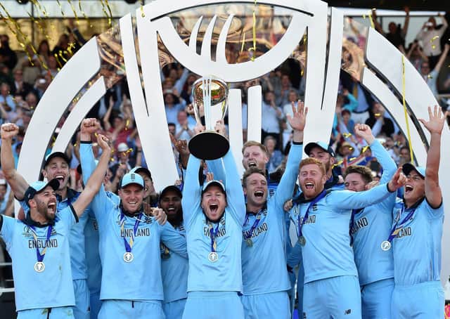 England's captain Eoin Morgan lifts the World Cup trophy as England's players celebrate their win after the 2019 Cricket World Cup final between England and New Zealand at Lord's Cricket Ground in London on July 14, 2019. - England won the World Cup for the first time as they beat New Zealand in a Super Over after a nerve-shredding final ended in a tie at Lord's on Sunday. (Photo by Glyn KIRK / AFP) / RESTRICTED TO EDITORIAL USE        (Photo credit should read GLYN KIRK/AFP via Getty Images)