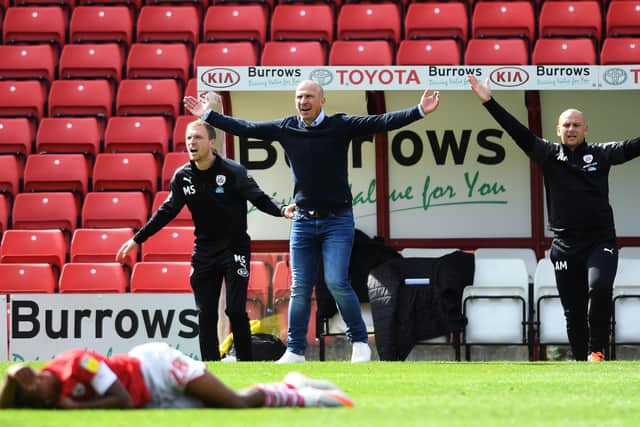 Barnsley's head coach Gerhard Struber shows his anger on the touchline after Wigan's Danny Fox fouled Elliot Simoes, for which he was sent off.
 Picture: Jonathan Gawthorpe