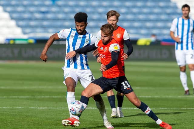 Andrew Shinnie closes down Huddersfield Town's Frazier Campbell at the John Smith's Stadium on Friday night  Picture: Bruce Rollinson