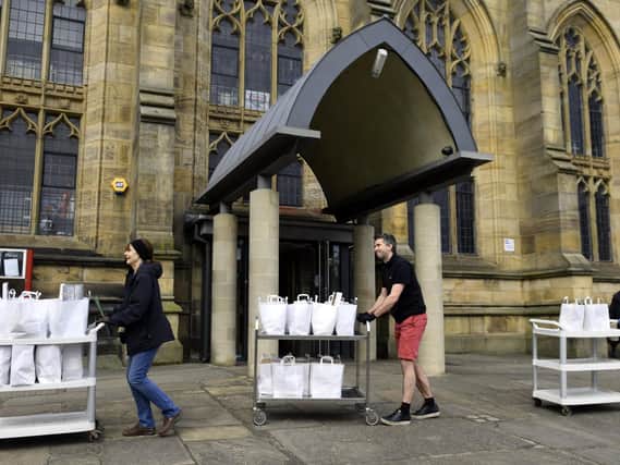 Age UK Sheffield volunteers taking food parcels from St Mary's Church in Sheffield in the city to be distributed to the elderly and vulnerable in April. Picture: Gary Longbottom