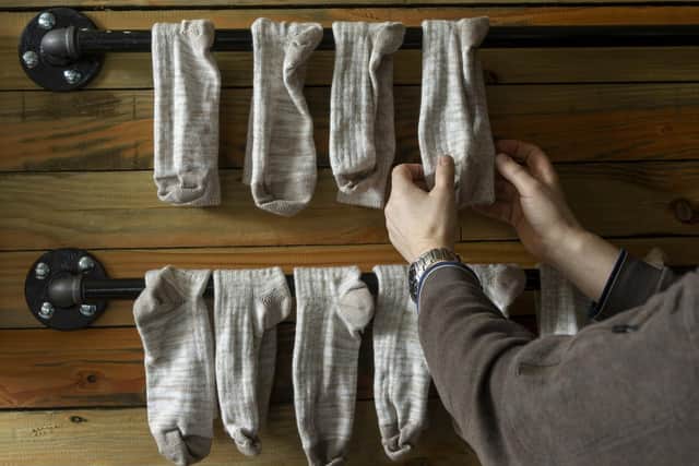 Socks racked up to dry after the washing process.