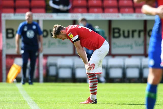 Barnsley's Michael Sollbauer dejected at fulltime - but in our Team of the Week (Picture: Jonathan Gawthorpe
)