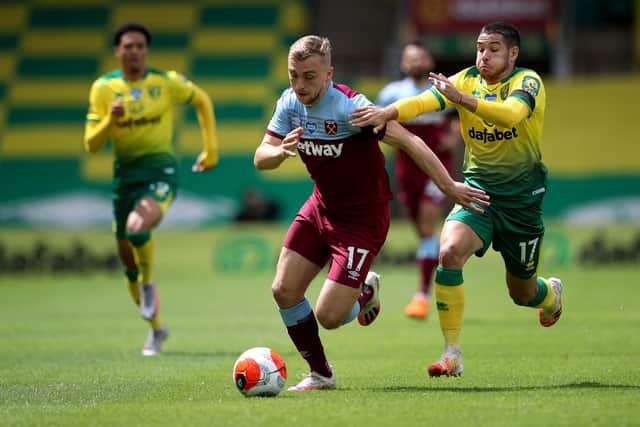 West Ham United's Jarrod Bowen (left) and Norwich City's Buendia Emi (right) during the Premier League match at Carrow Road, Norwich. PA Photo. Issue date: Saturday July 11, 2020. See PA story SOCCER Norwich. Photo credit should read: Alex Pantling/NMC Pool/PA Wire. RESTRICTIONS: EDITORIAL USE ONLY No use with unauthorised audio, video, data, fixture lists, club/league logos or "live" services. Online in-match use limited to 120 images, no video emulation. No use in betting, games or single club/league/player publications.