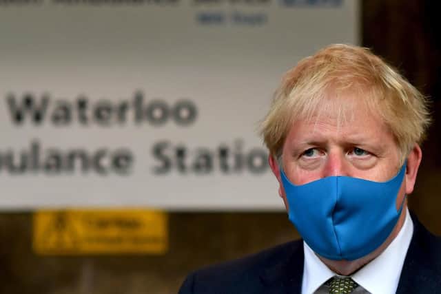 Boris Johnson has been accused of issuing mixed messages over face masks.