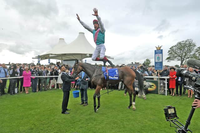 This was Frankie Dettori celebrating Enable's win in the Yorkshire Oaks last year.