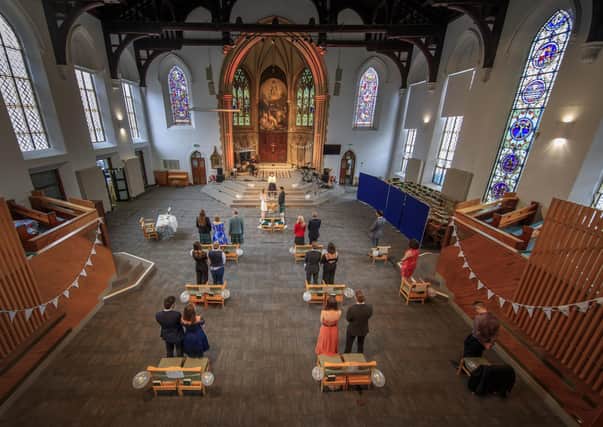 Churches like St George's Church in Leeds are having to conform to social distancing - even for weddings. Photo: Danny Lawson/PA Wire