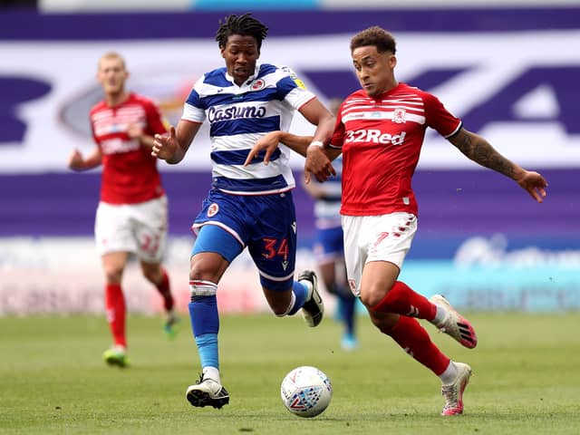 Reading's Gabriel Osho (left) and Middlesbrough's Marcus Tavernier battle for the ball . Picture: PA