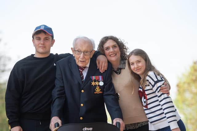 Captain Tom Moore, with (left to right) grandson Benji, daughter Hannah Ingram-Moore and granddaughter Georgia, at his home in Marston Moretaine, Bedfordshire.