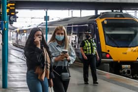 Passengers wearing face masks at Leeds railway station. Photo: PA