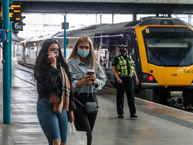 Passengers wearing face masks at Leeds railway station. Photo: PA