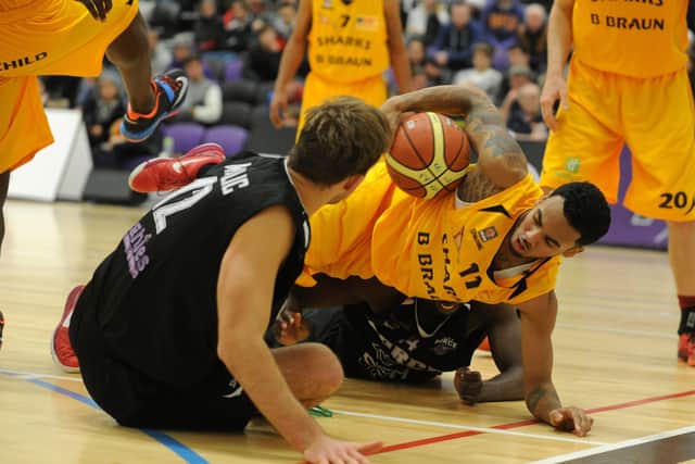 Nick Lewis, during his first spell with Sheffield Sharks, scambled for the ball against 
Leeds Force (Picture: Bruce Rollinson)