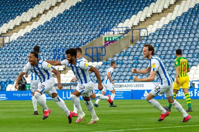 Chris Willock celebrates scoring Huddersfield Town's opening goal against West Bromwich Albion. Picture Bruce Rollinson