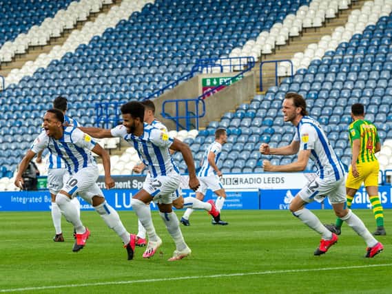 OPENER: Huddersfield Town celebrate opening the scoring through Chris Willock