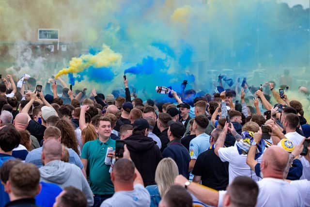 Leeds United fans outside Elland Road celebrate the club's return to the Premier League. Photo: Bruce Rollinson.