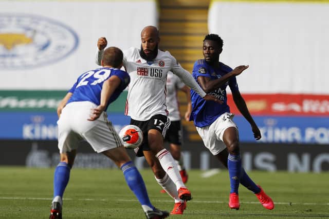 TOUGH NIGHT: Sheffield United's David McGoldrick takes on Leicester City's Wilfred Ndidi on Thursday evening. Picture: Darren Staples/Sportimage