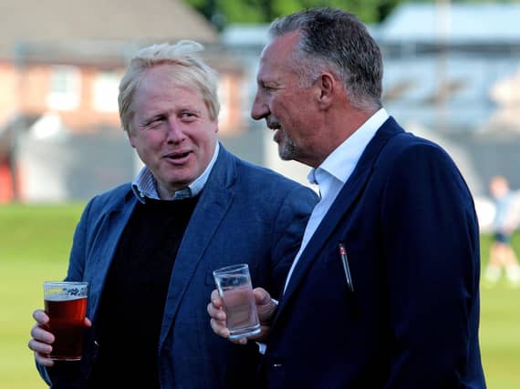Boris Johnson talking to Sir Ian Botham, prior to a knock-about during a visit to Chester Le Street Cricket Club in County Durham