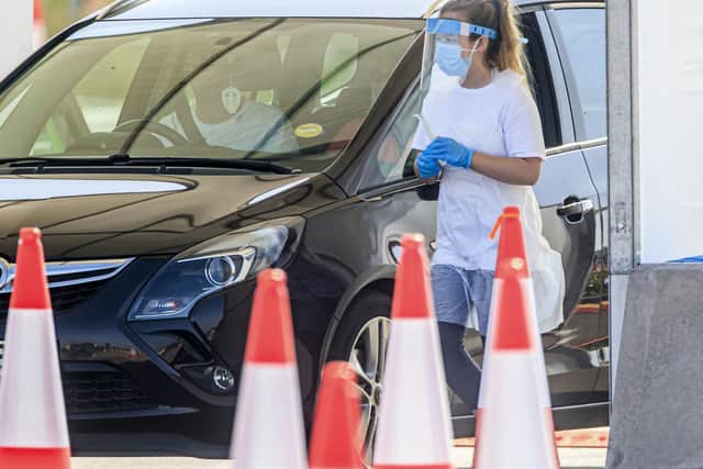Samples are taken in May at a coronavirus testing facility in Temple Green Park and Ride, Leeds, as NHS Test and Trace - seen as key to easing the lockdown restrictions - is rolled out across England. PA Photo.